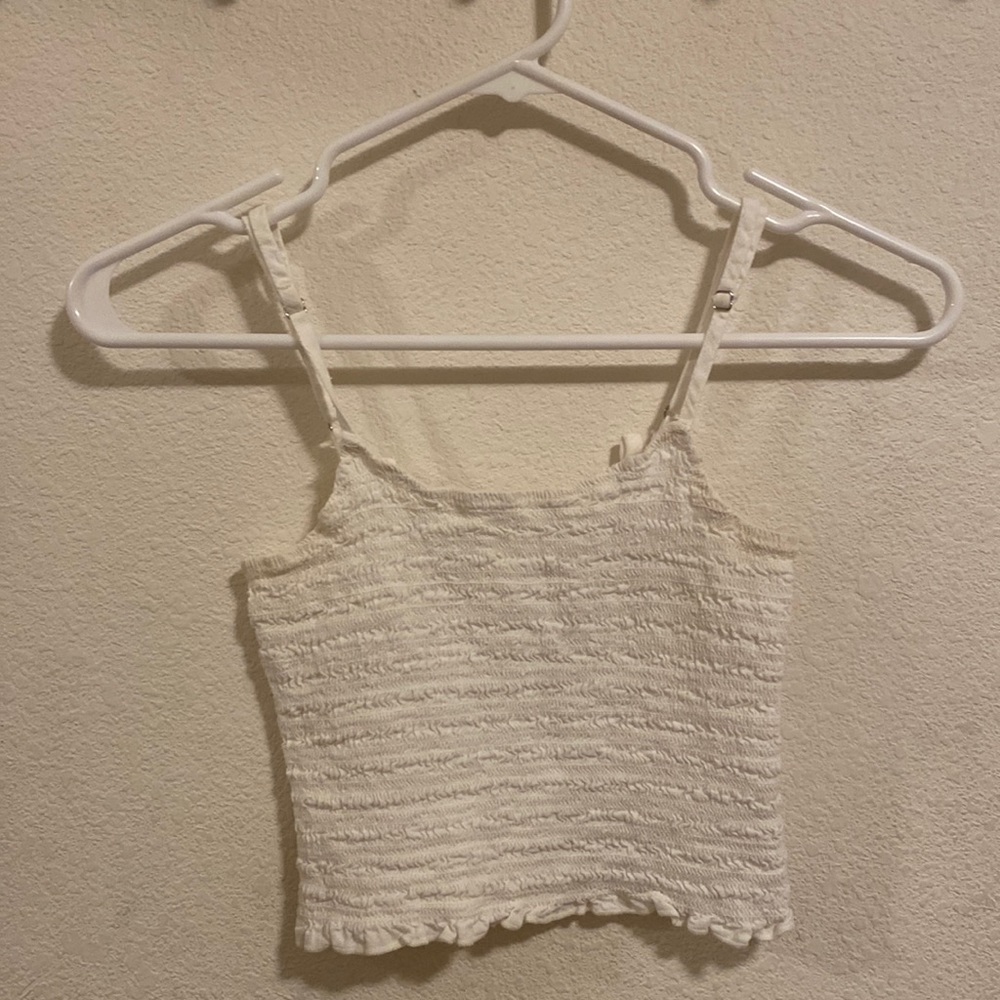 John Galt white textured tank top. From Brandy Melville so it’s one size (xs)